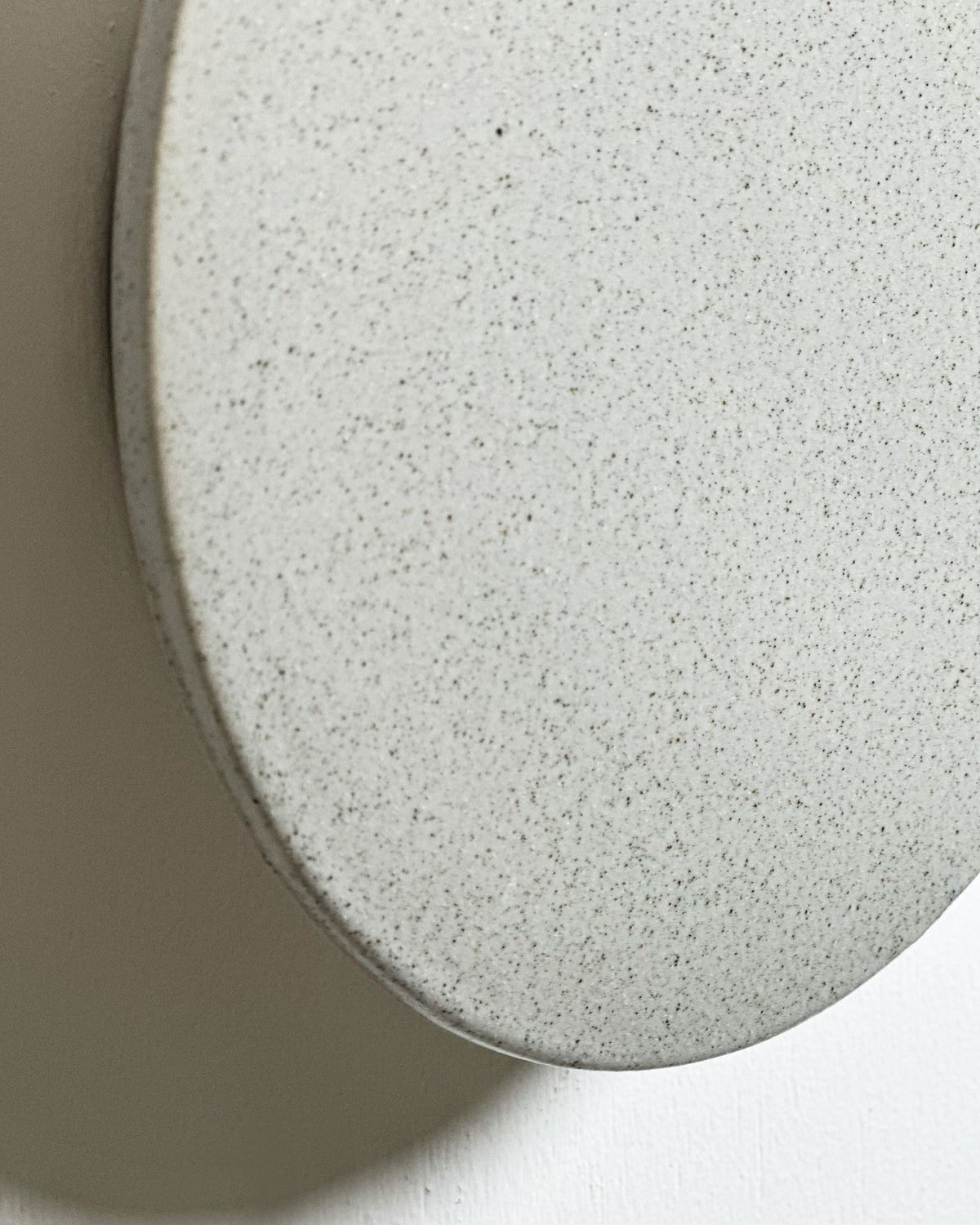 Small Backlit Disc Wall Light in Stone