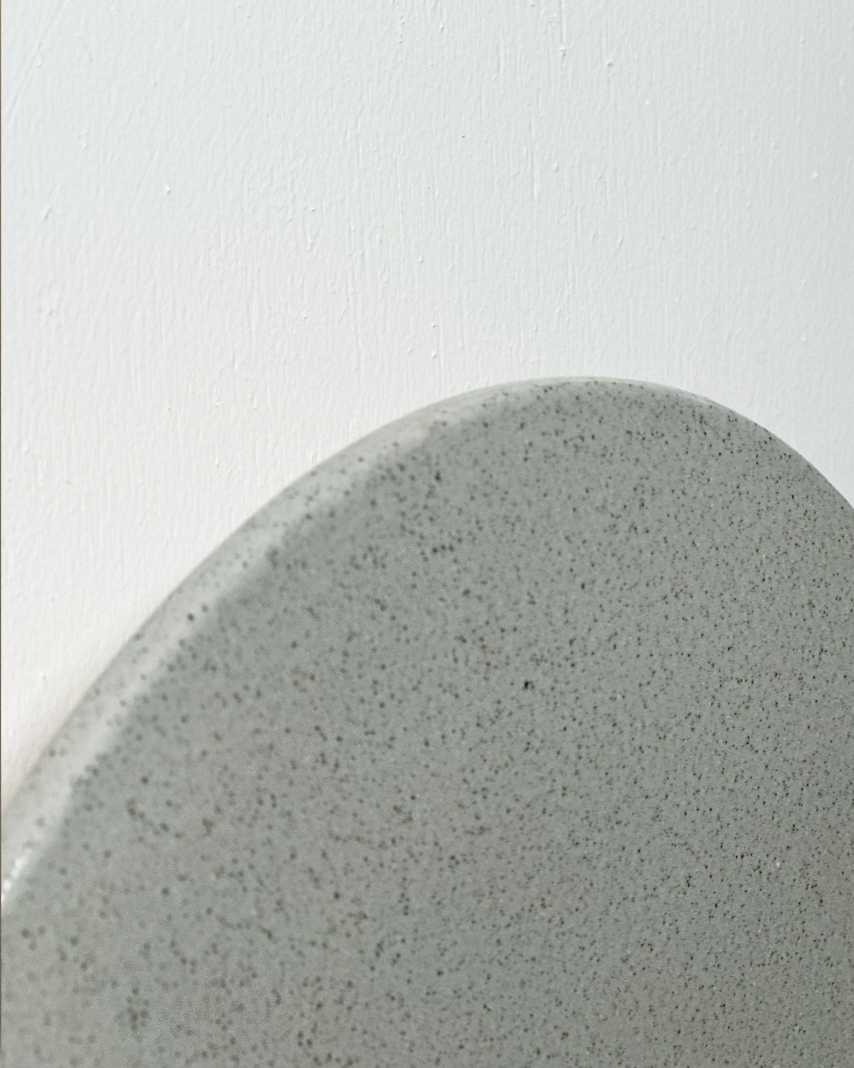 Small Backlit Disc Wall Light in Stone