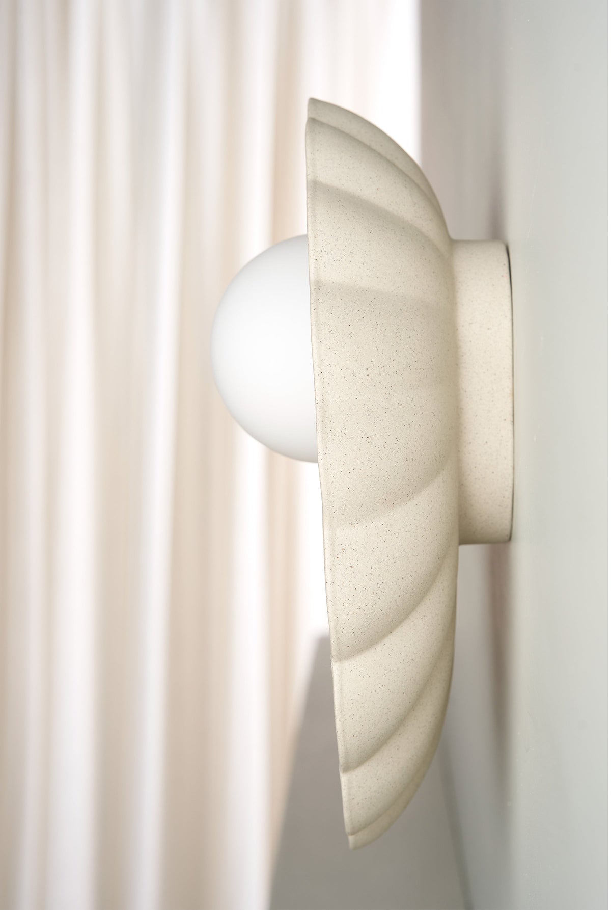Oyster Wall Sconce in Stone
